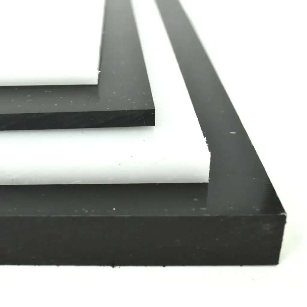 Stacked black and white engineering plastic sheets