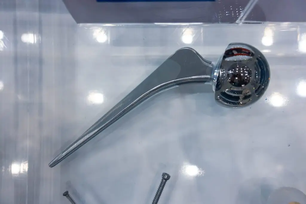 Polished metal orthopedic implant component